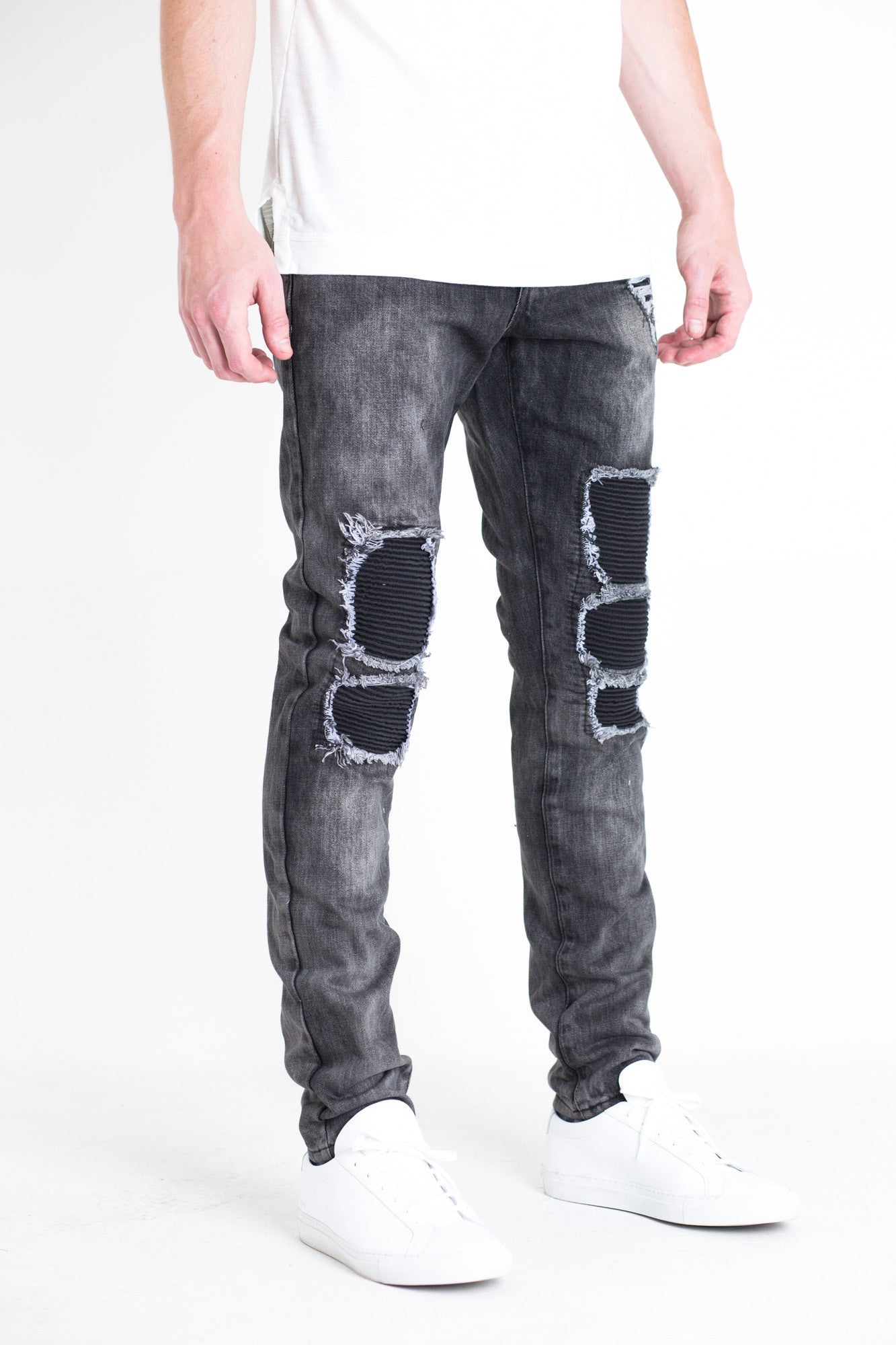 Ellis Ripped Denim | Embellish X Quincy Capsule Collection Charcoal washed denim Distressed patchwork with biker ribbing details 100% cotton Skinny fit 34" standard inseam